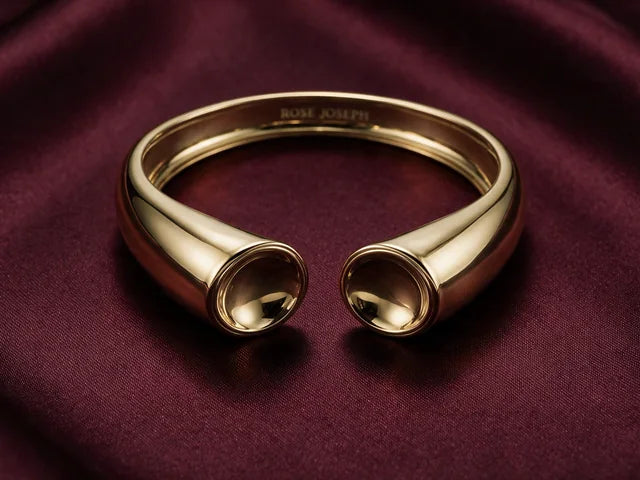 The Patera Cuff in gold on wine silk