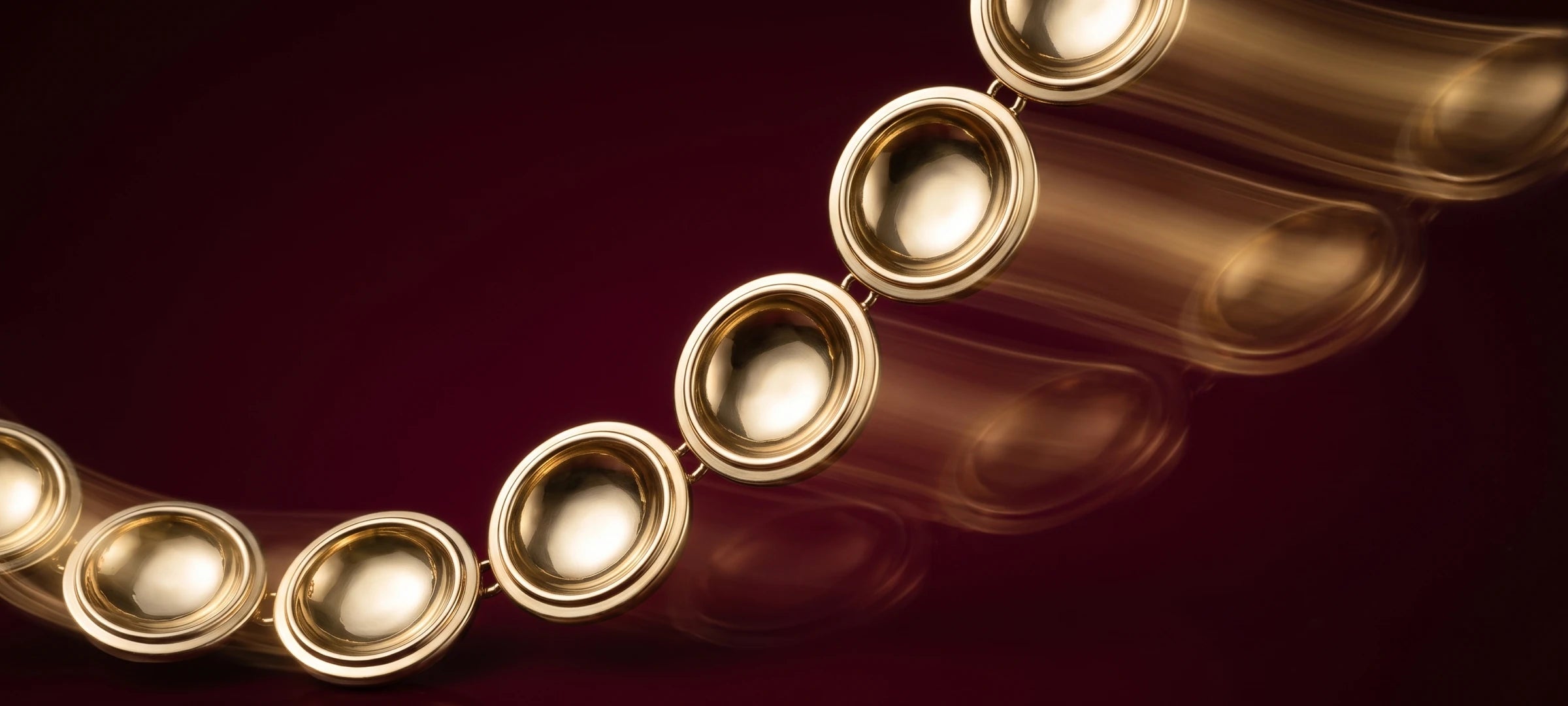 Close view of the gold discs of the Patera Necklace
