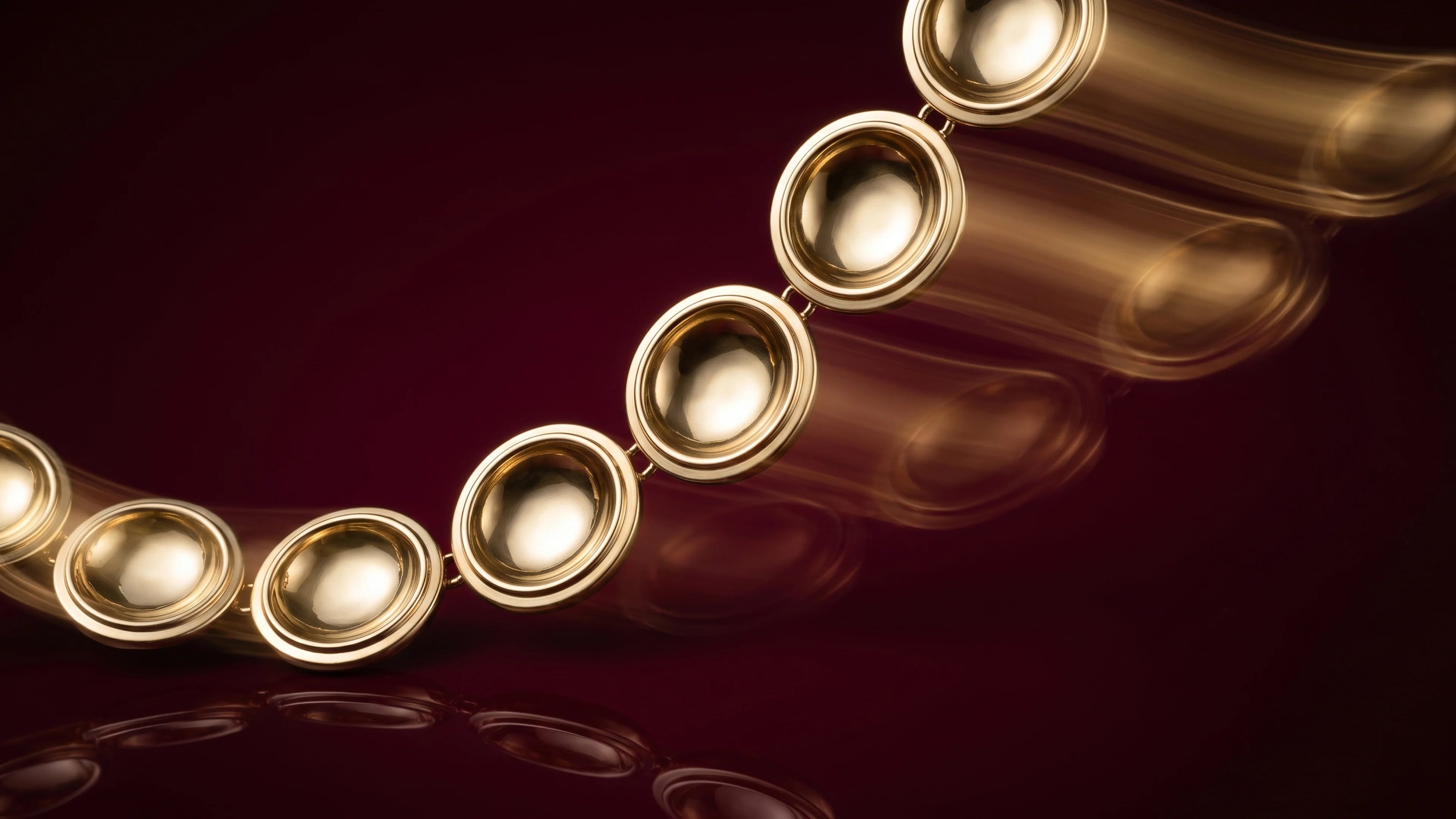 Close view of the gold discs of the Patera Necklace